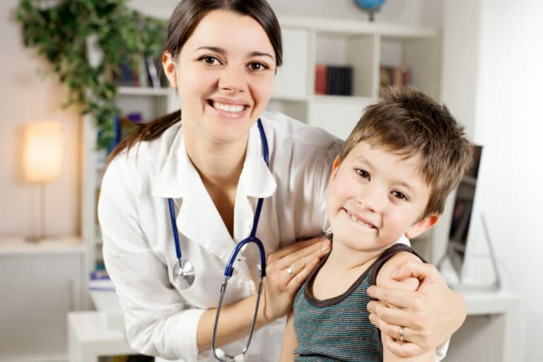 Healthcare team - Doctor examining young patient