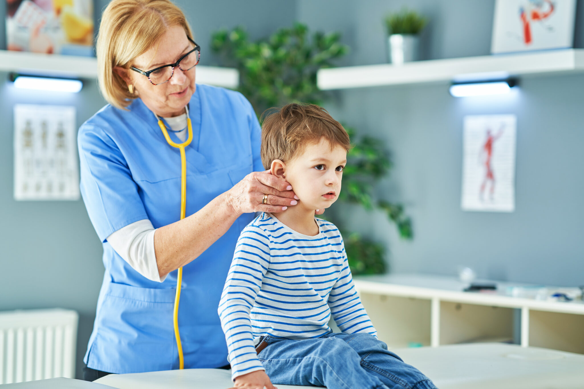 Doctor examining child patient